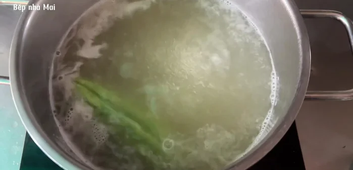 Prepare the bitter melon: Slice some of it and set aside, cook the remaining bitter melon in chicken bone broth for about 1 hour over low heat.