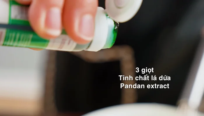 Add pandan essence for color and aroma. Mix well immediately as the powder acts quickly.