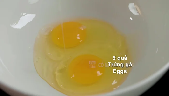 In another bowl, whisk eggs lightly. Add the warm coconut milk mixture and a pinch of salt. Mix well.