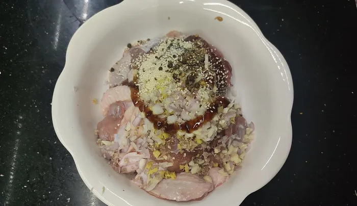 Sauté the marinated duck with a little five-spice powder until slightly cooked.