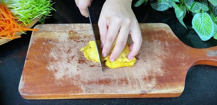 Assemble the rolls: Arrange lettuce, herbs, cooked pork, eggs, carrots, cucumbers, and bean sprouts on a tray. Use a portion of the aromatic fish sauce mixture as a dipping sauce.