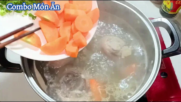 After 30 minutes of simmering, add the carrots and continue cooking for another 10 minutes.