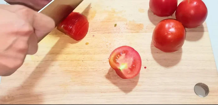 Cut the tomatoes in half, then into small pieces (or blend for a smoother sauce).