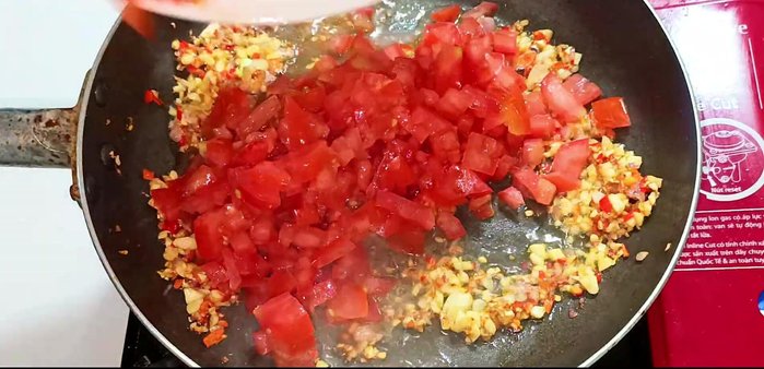 Add tomatoes and stir-fry until soft. Mash gently with a ladle.