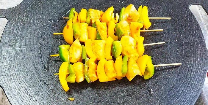 Grill the skewers using a grill pan, oven, air fryer, or non-stick pan until the mushrooms are golden brown and fragrant (243.879).