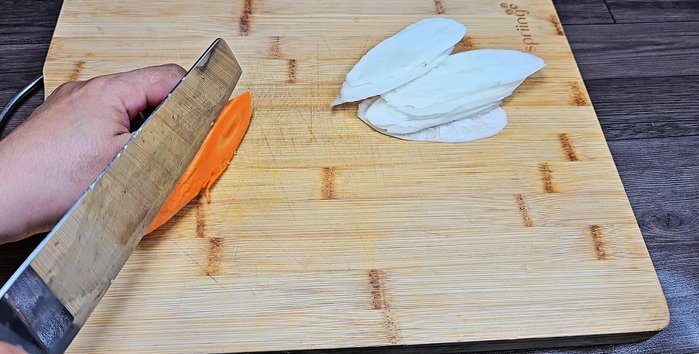 Prepare the pickles: Thinly slice white radish and carrots. (You can grate them if you prefer).