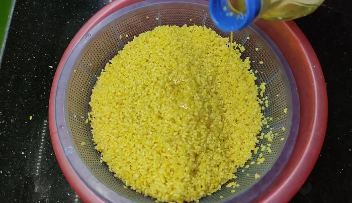 Steam the rice in a steamer above boiling water. For a smaller amount of rice, steam for about 30 minutes total.