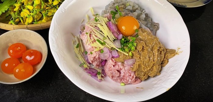 Crack the duck eggs into the bowl. Separate 2 egg yolks to use later for decoration.