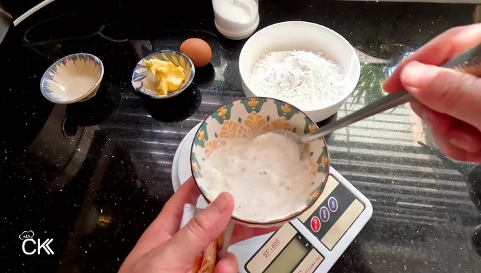 Prepare the yeast mixture: In a bowl, combine sugar and yeast. Cover and let stand for 5-7 minutes (163.84).