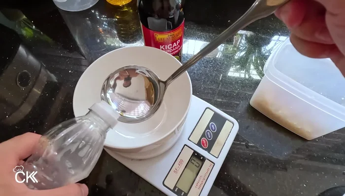 Prepare the sauce mixture: In a pot, combine rice vinegar, dark soy sauce (half initially), sugar, and salt.