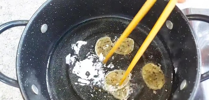 Heat oil in a frying pan until very hot. Carefully fry the dried crackers until they are puffed, crispy, and golden brown.