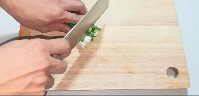 Wash and chop green onions.