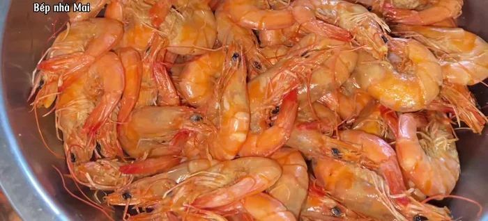 Peel the cooked shrimp.