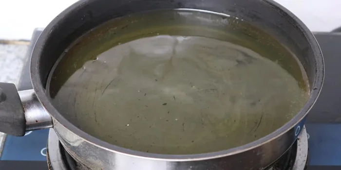 Fry the wrapped cakes in hot oil over low heat until golden brown.