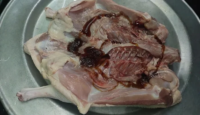Marinate the duck with oyster sauce, MSG, salt, seasoning powder, soy sauce, honey, lemongrass, ginger, garlic, and minced shallots. Ensure both inside and outside are marinated.