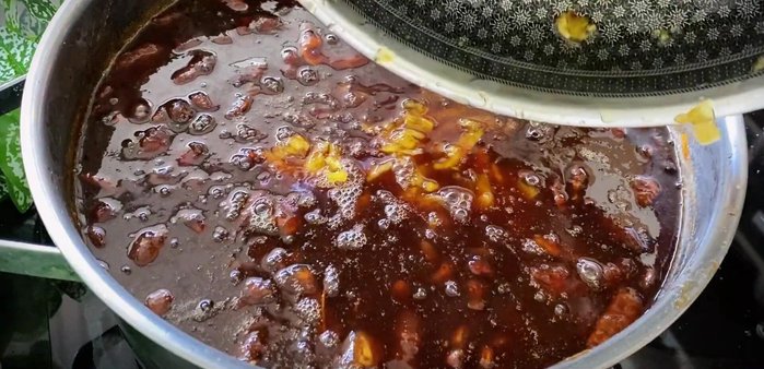 Combine and simmer: Add the cooked pineapple to the tamarind mixture. Stir well and simmer for another 40 minutes until the tamarind mixture thickens and turns a deep caramel color. Add jackfruit (optional).