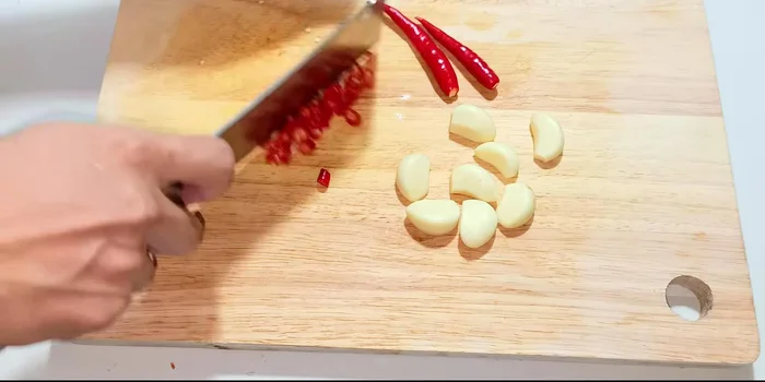 Prepare sauces: Make two sauces: one for dipping and one for mixing. Each requires fish sauce, sugar, lemon juice, and chili sauce (adjust to your spice preference).
