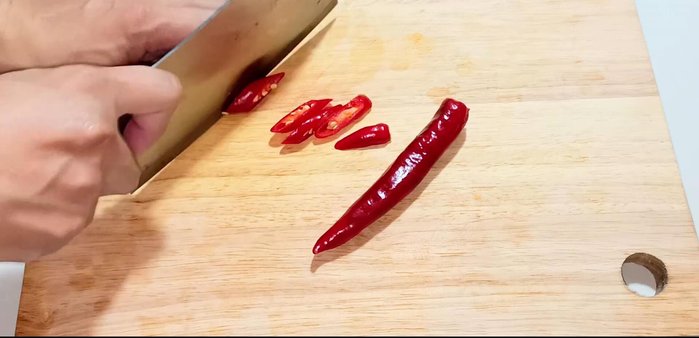Wash chili peppers and cut them diagonally, removing seeds if desired. (63.719)