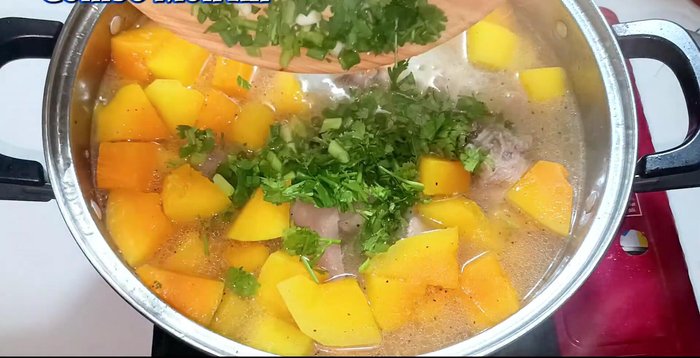 Add green onions and coriander. Stir well.