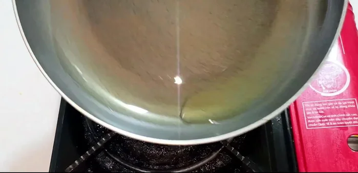 Heat cooking oil in a pan over medium heat. Fry ribs until golden, turning frequently and pressing gently to ensure even cooking and puffiness.