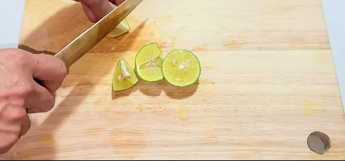 Prepare the dipping sauce: Grind chili and garlic until smooth. Add fish sauce, sugar, and lemon juice to taste.