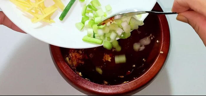 Marinate the fish: In a bowl, combine the pureed onion heads, ginger, sugar, salt, pepper, and fish sauce. Mix well and coat the pomfret evenly, including the inside.