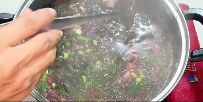 Stir in the chopped green onions. Turn off heat.