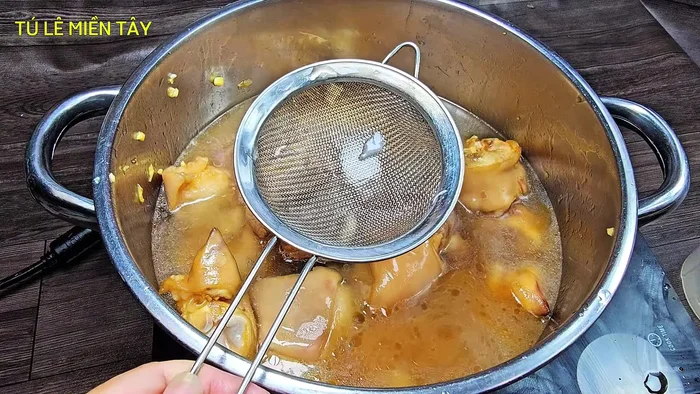 Add liquids and spices: Add the fresh coconut water, filtered water, and remaining spices (fish sauce, sugar, MSG). Bring to a boil, skim off any foam.