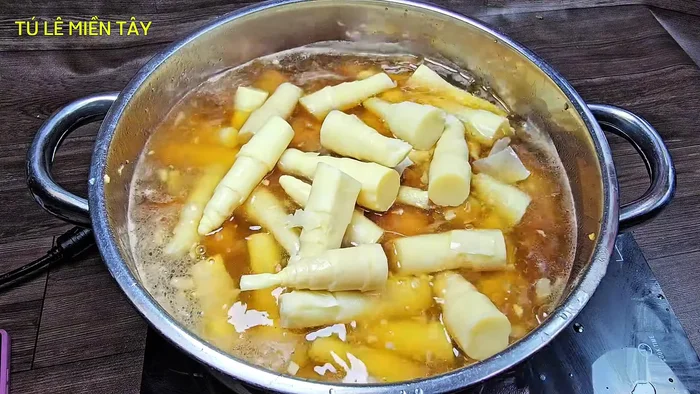 Add bamboo shoots: Add the prepared bamboo shoots to the pot.