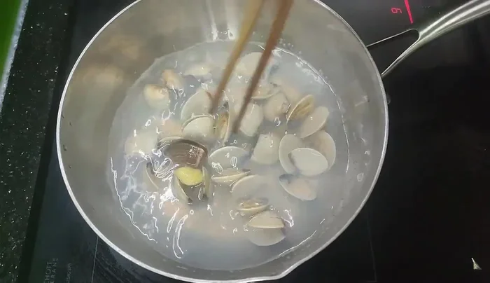 Boil clams until their mouths open.