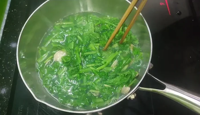 Boil until the mustard greens are cooked and bubbly.