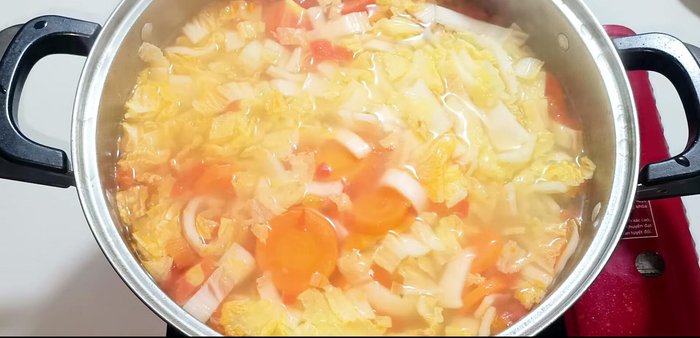 Reduce heat to low, mix well, and season with vegetarian seasoning, MSG, sugar, salt, and pepper.