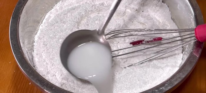Add coconut milk (slightly warm, 30-40°C). Stir until the batter is smooth and even.