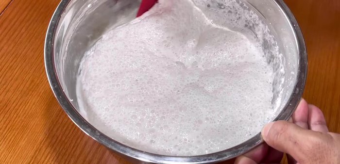 Combine batter and sugar water: Once the first fermentation is complete, stir the dough well. Add the slightly warm sugar water and mix thoroughly. Optional: Strain the mixture through a sieve to remove any palm sugar impurities.