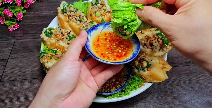 Serve and enjoy! Dip the bread rolls in the sweet and sour fish sauce.