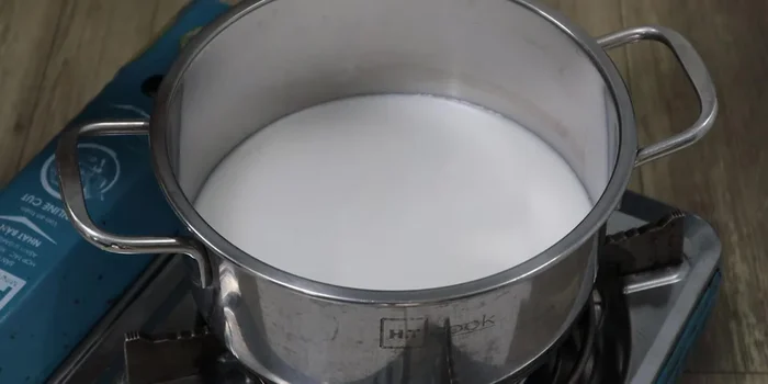 In a pot, combine coconut milk (reserve a little), tapioca starch, and rice flour. Stir until dissolved.