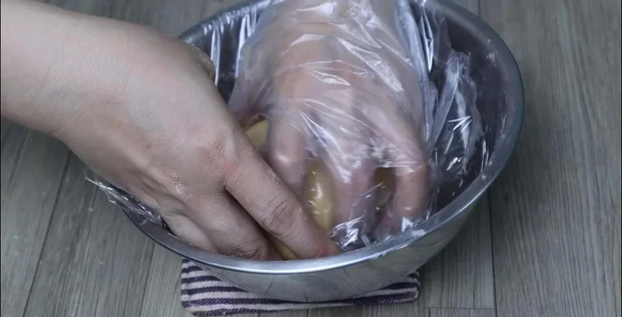 Wrap the dough in plastic wrap and let it rest for 30 minutes to 1 hour.