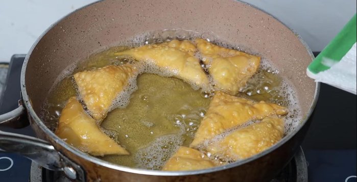 Remove wontons and place them on paper towels to absorb excess oil.