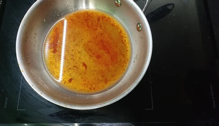 Once chicken wings are fried, add them to the sauce and coat evenly.
