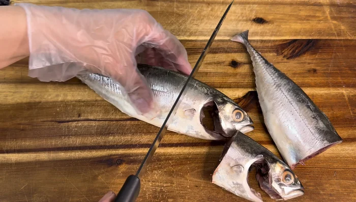 Cut the fish into two pieces.