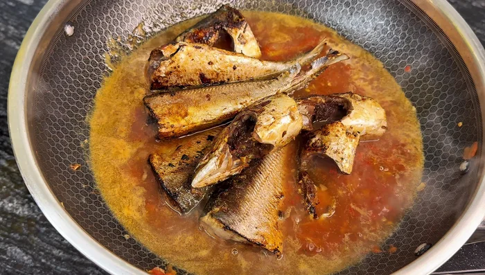 Add the smaller pieces of eggplant and the fish. Simmer for 20 minutes, stirring occasionally.