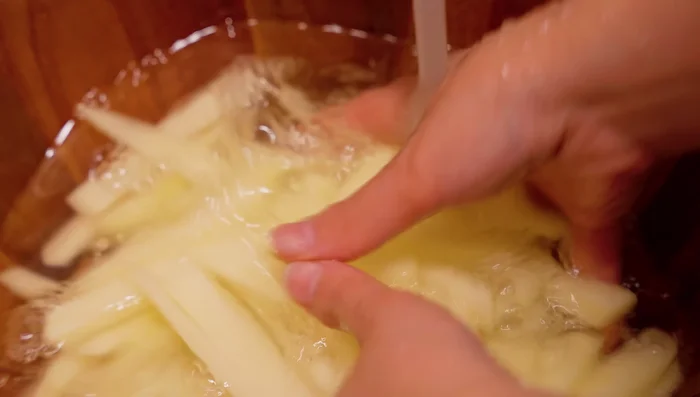Wash the potatoes until the water runs clear to remove excess starch.