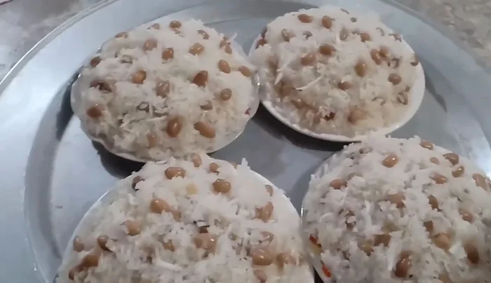 Serve the sticky rice with peanuts and shredded coconut.