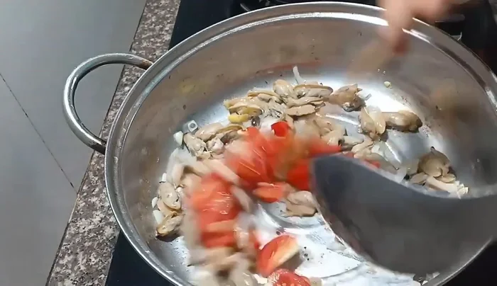 Add tomatoes to the pot and stir-fry until softened (3-5 minutes).