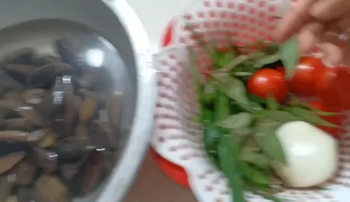 Prepare the vegetables: chop onions, ginger, and chives. Cut tomatoes into wedges.