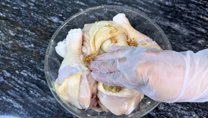 Marinate chicken with sautéed onion and garlic.