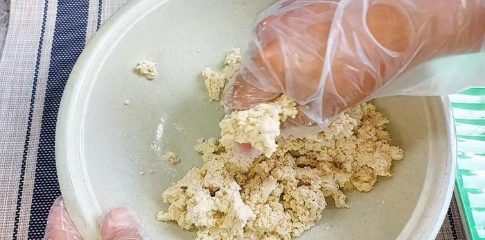 In a bowl, mix the squeezed tofu with 1 tsp vegetarian seasoning, 1 tsp ground pepper, and some tapioca starch.