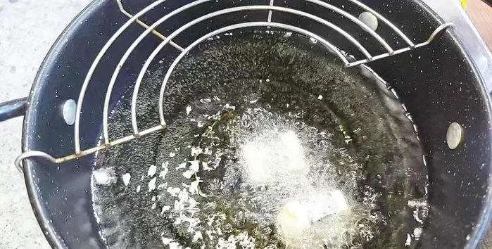 Fry the tofu until golden brown, ensuring to cook quickly to prevent oil absorption.