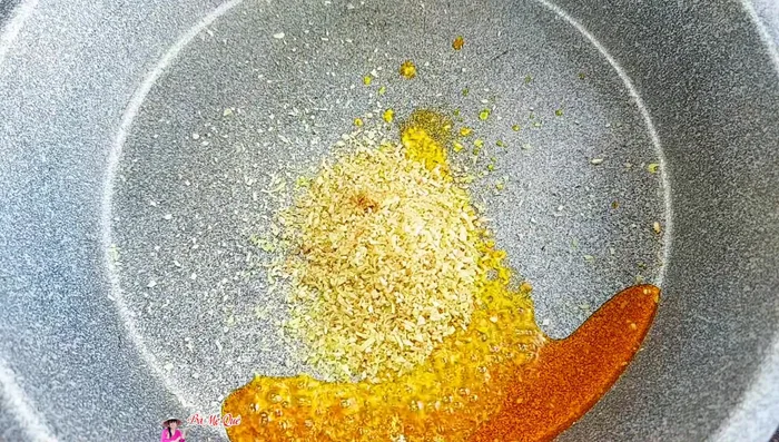 Heat annatto oil in a pan. Add minced lemongrass and stir-fry until fragrant and golden.