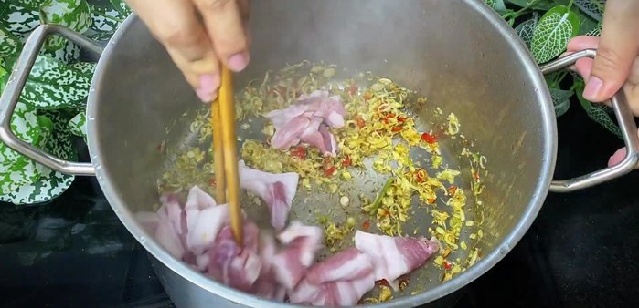 Add pork belly and stir-fry until browned. The spices will infuse the meat.